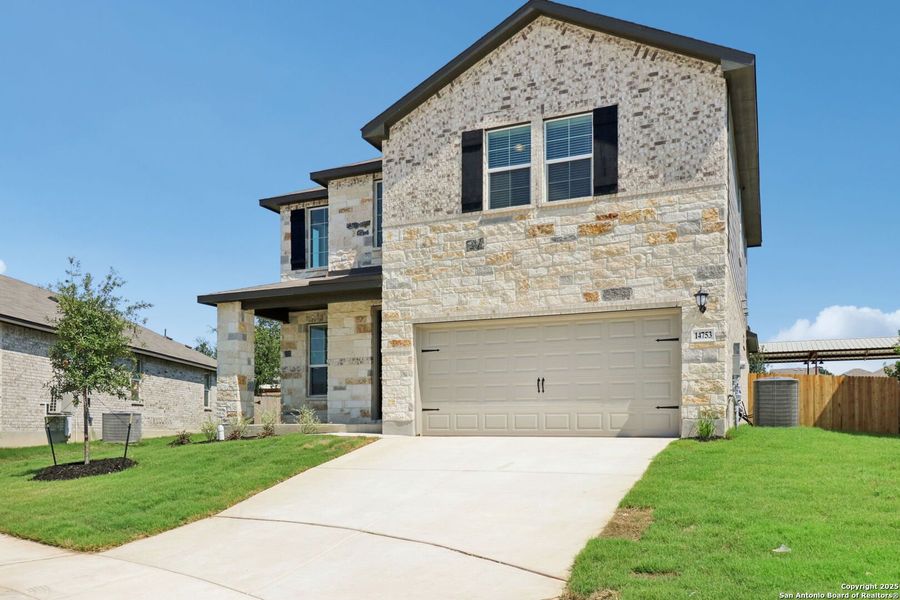 Front exterior of a new home in Thomas Pond, San Antonio, TX, highlighting curb appeal (Image 2). Front exterior of a new home in Thomas Pond, San Antonio, TX, highlighting curb appeal (Image 2).