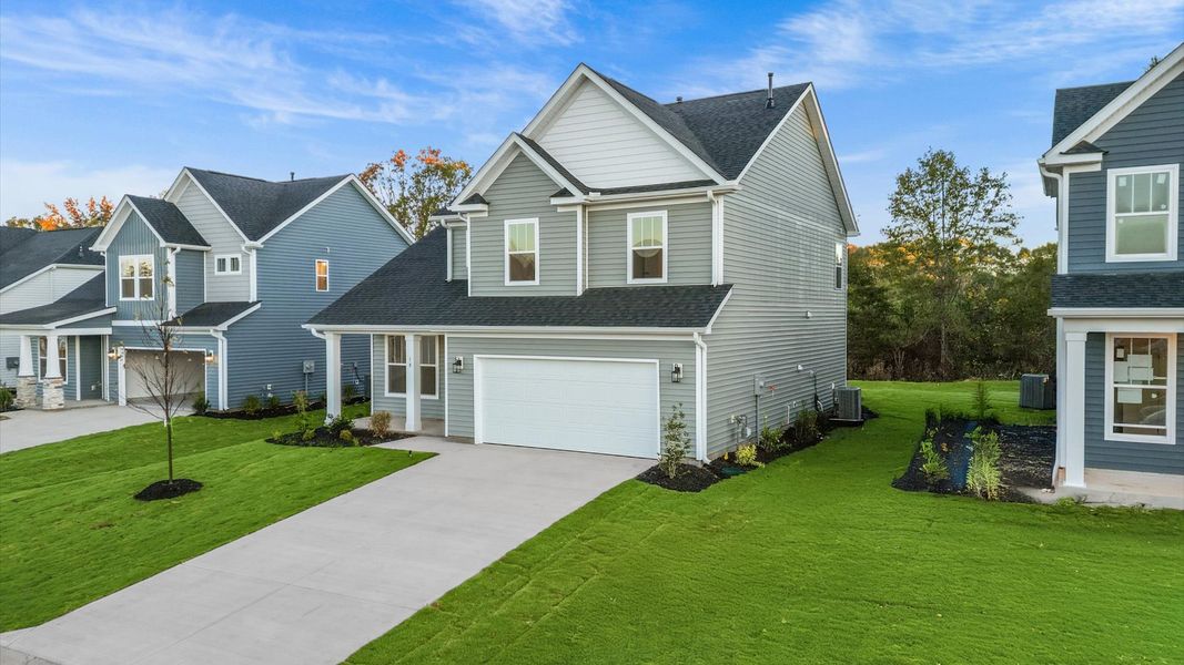 Front exterior of a new home in Woodglen, Piedmont, SC, highlighting curb appeal (Image 20). Front exterior of a new home in Woodglen, Piedmont, SC, highlighting curb appeal (Image 20).
