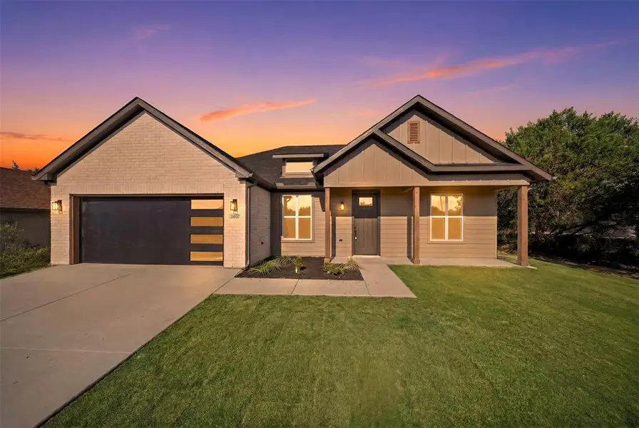 Front exterior of a new home in , Granbury, TX, highlighting curb appeal (Image 1). Front exterior of a new home in , Granbury, TX, highlighting curb appeal (Image 1).