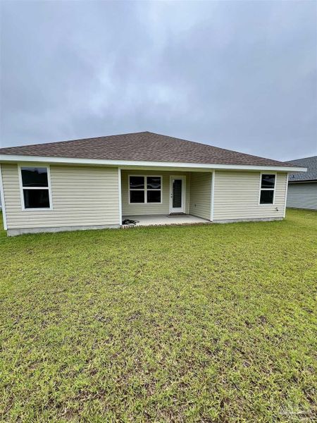 Front exterior of a new home in Pine Top, Cantonment, FL, highlighting curb appeal (Image 2).