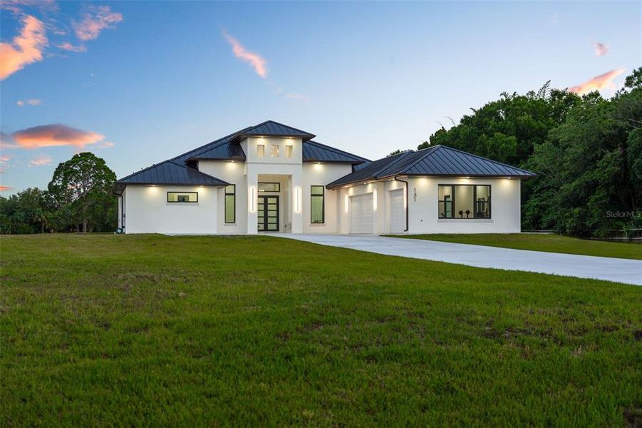 Front exterior of a new home in , Palm Bay, FL, highlighting curb appeal (Image 22). Front exterior of a new home in , Palm Bay, FL, highlighting curb appeal (Image 22).