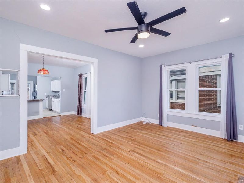 Living Room leads to dining room - original hardwood floors