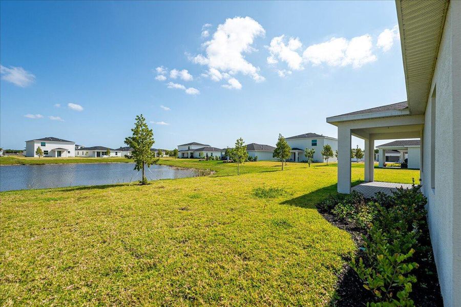 Front exterior of a new home in Seagrove: The Indies, Fort Pierce, FL, highlighting curb appeal (Image 20).
