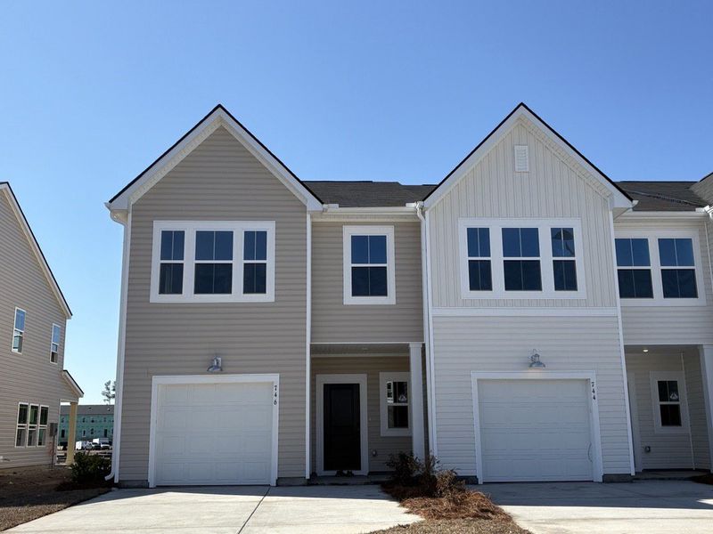 Front exterior of a new home in Lindera Preserve at Cane Bay Plantation, Summerville, SC, highlighting curb appeal (Image 1). Front exterior of a new home in Lindera Preserve at Cane Bay Plantation, Summerville, SC, highlighting curb appeal (Image 1).