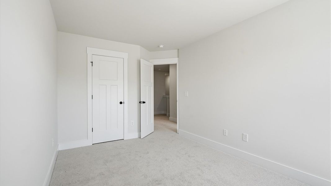Elegant bedroom retreat featuring soft carpeting and a thoughtfully designed walk-in closet at Saluda Crossing Elegant bedroom retreat featuring soft carpeting and a thoughtfully designed walk-in closet at Saluda Crossing