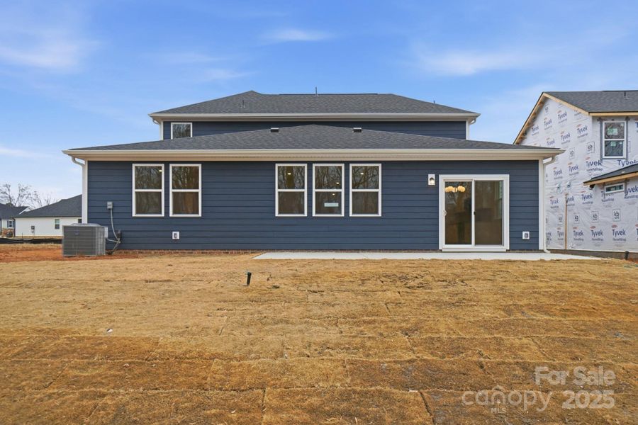 Exterior details and patio area of a home in Wellington Pointe Executive, Monroe (Image 19).