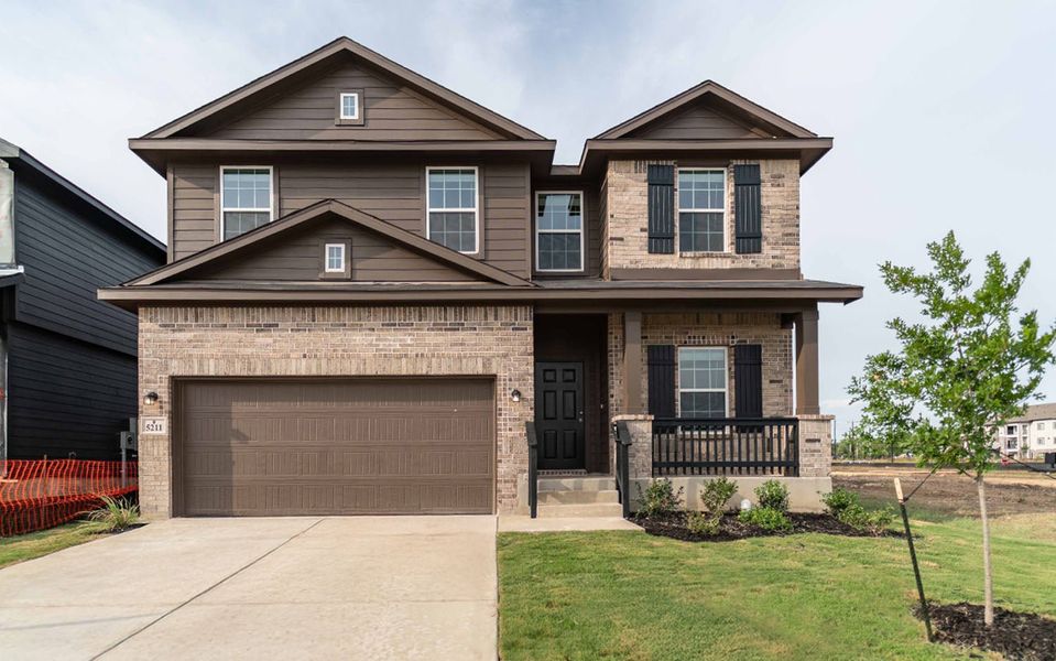 Front exterior of a new home in Mesa Vista, Von Ormy, TX, highlighting curb appeal (Image 1). Front exterior of a new home in Mesa Vista, Von Ormy, TX, highlighting curb appeal (Image 1).