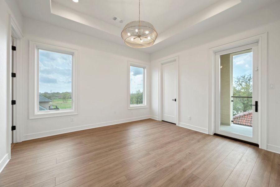 4th bedroom with built in desk and access to balcony