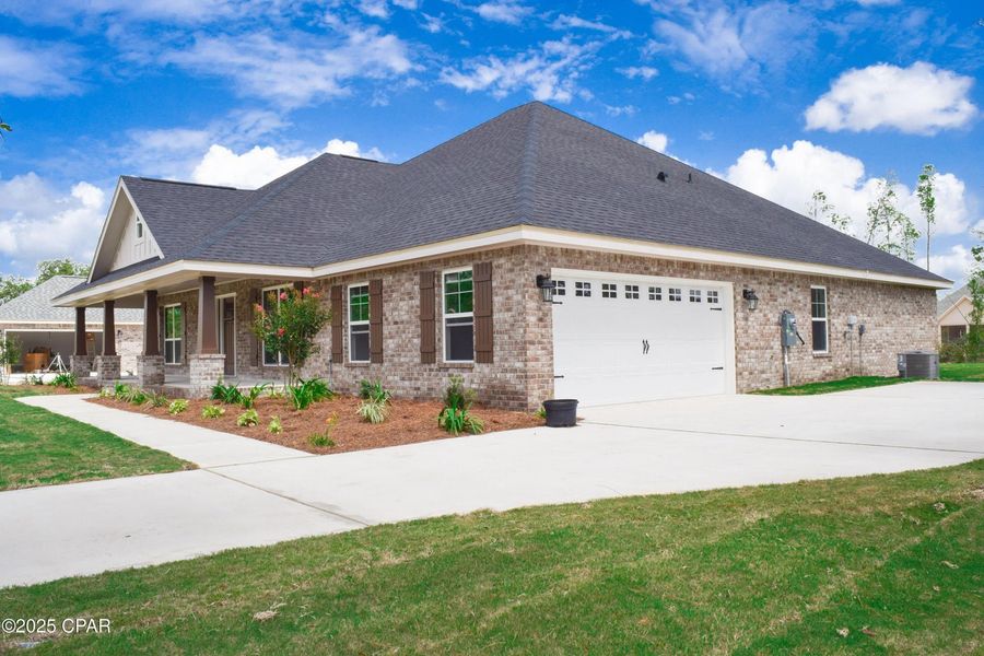 Front exterior of a new home in Cedar Creek at Deerpoint Lake, Panama City, FL, highlighting curb appeal (Image 2).