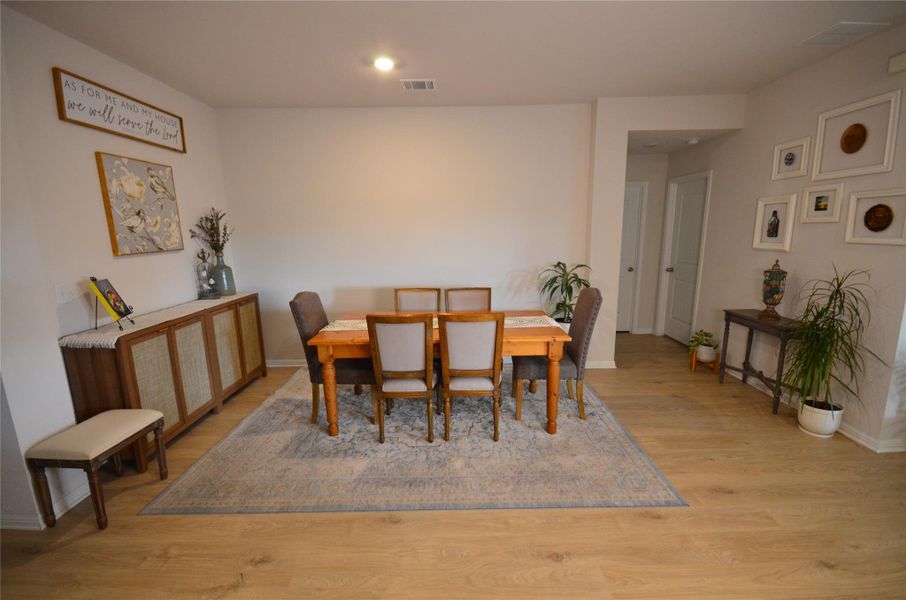 Dining space featuring light wood-style flooring and recessed lighting Dining space featuring light wood-style flooring and recessed lighting