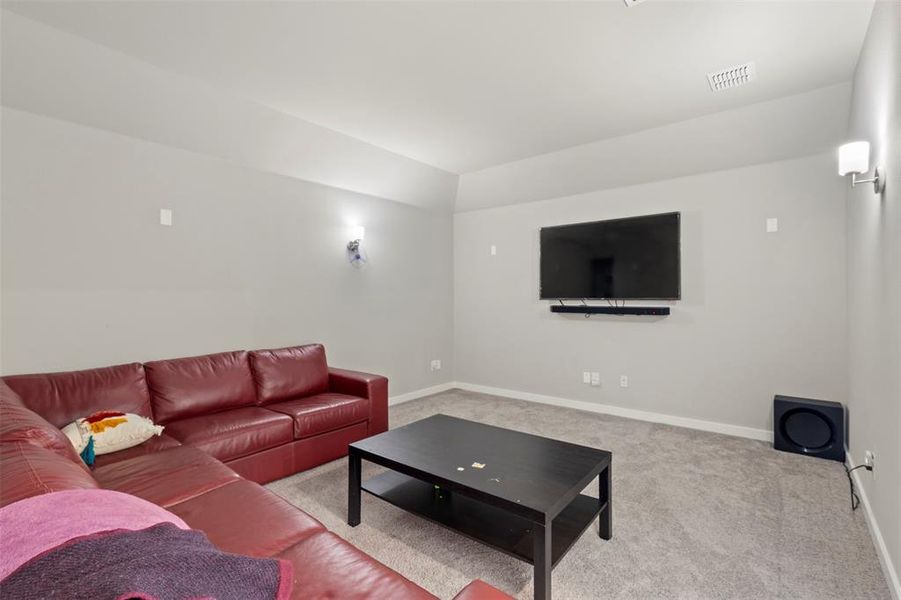 Living room with carpet floors and baseboards