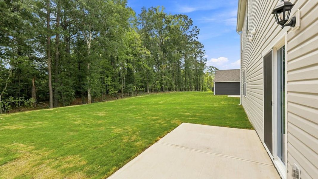 Exterior details and patio area of a home in Hunters Ridge, Woodruff (Image 22).