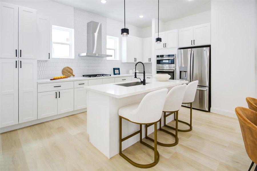 Welcome to the second floor where you are greeted by the stunning kitchen.