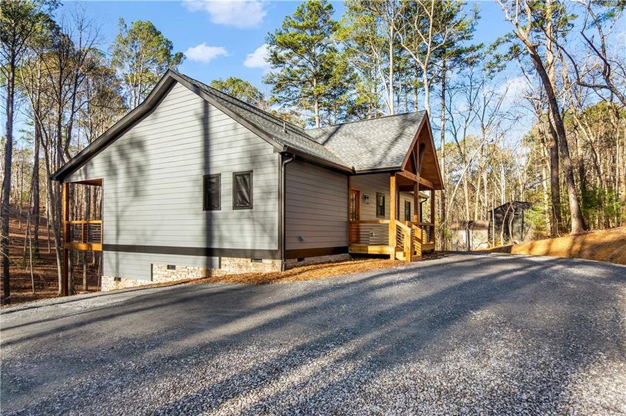 Exterior details and patio area of a home in , Ellijay (Image 26).
