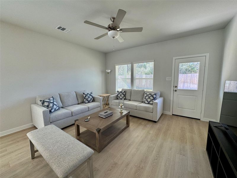 Bright, modern living room with neutral tones, featuring ample natural light from large windows and a wooded view to the reserve. Bright, modern living room with neutral tones, featuring ample natural light from large windows and a wooded view to the reserve.