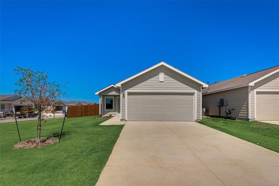 Ranch-style house with driveway and an attached garage Ranch-style house with driveway and an attached garage