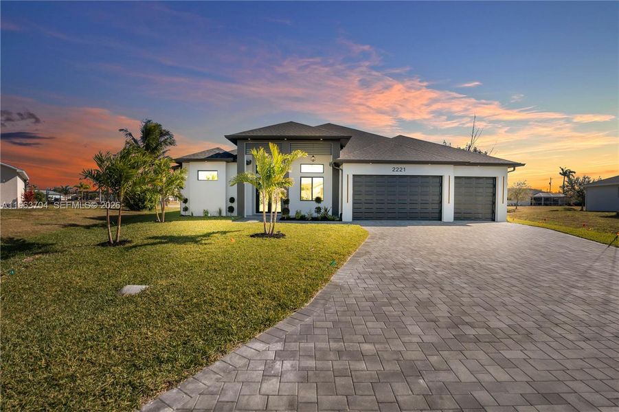 Front exterior of a new home in , Cape Coral, FL, highlighting curb appeal (Image 25).