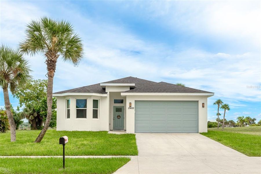 Front exterior of a new home in , Port Charlotte, FL, highlighting curb appeal (Image 1).