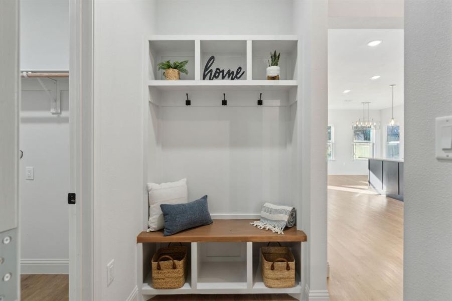 Mudroom with light hardwood / wood-style flooring