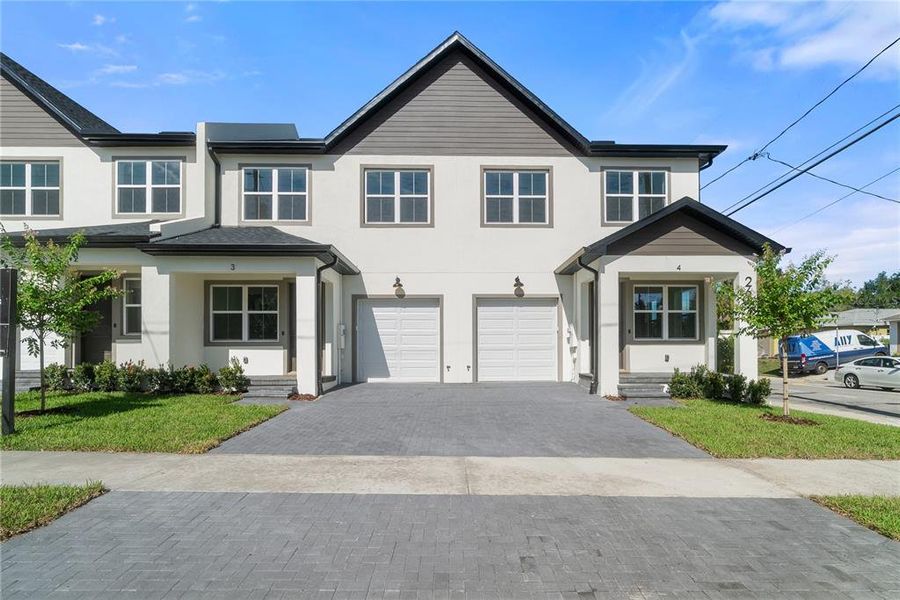 Front exterior of a new home in , Tampa, FL, highlighting curb appeal (Image 24).