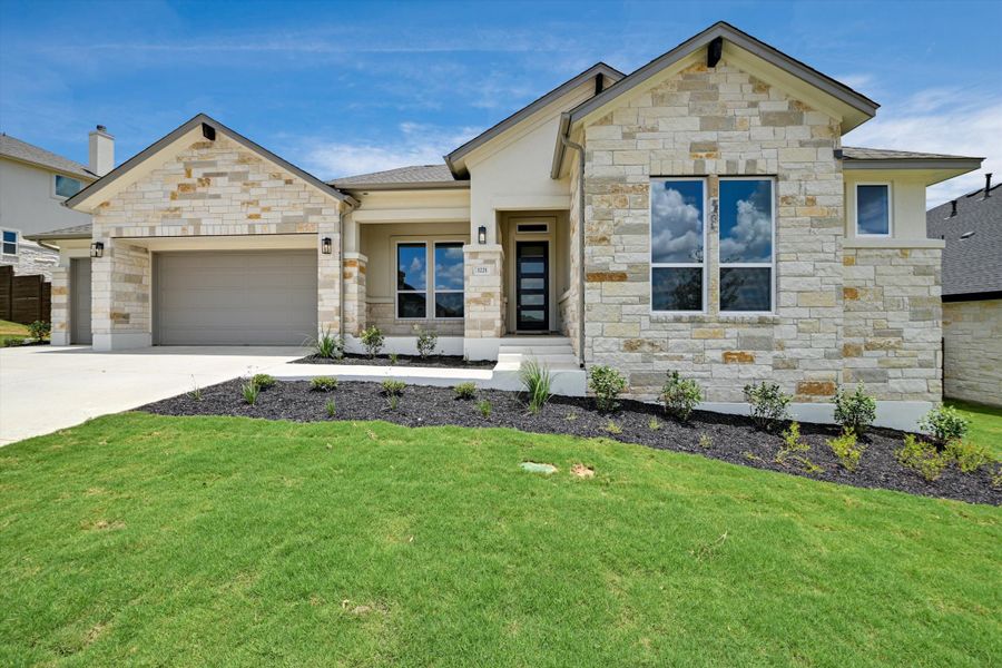 Representative exterior photo of a completed home built from the Opal by Giddens Homes in Riverstone, Georgetown, TX (Image 20).