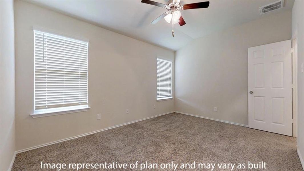Carpeted empty room with ceiling fan and vaulted ceiling Carpeted empty room with ceiling fan and vaulted ceiling
