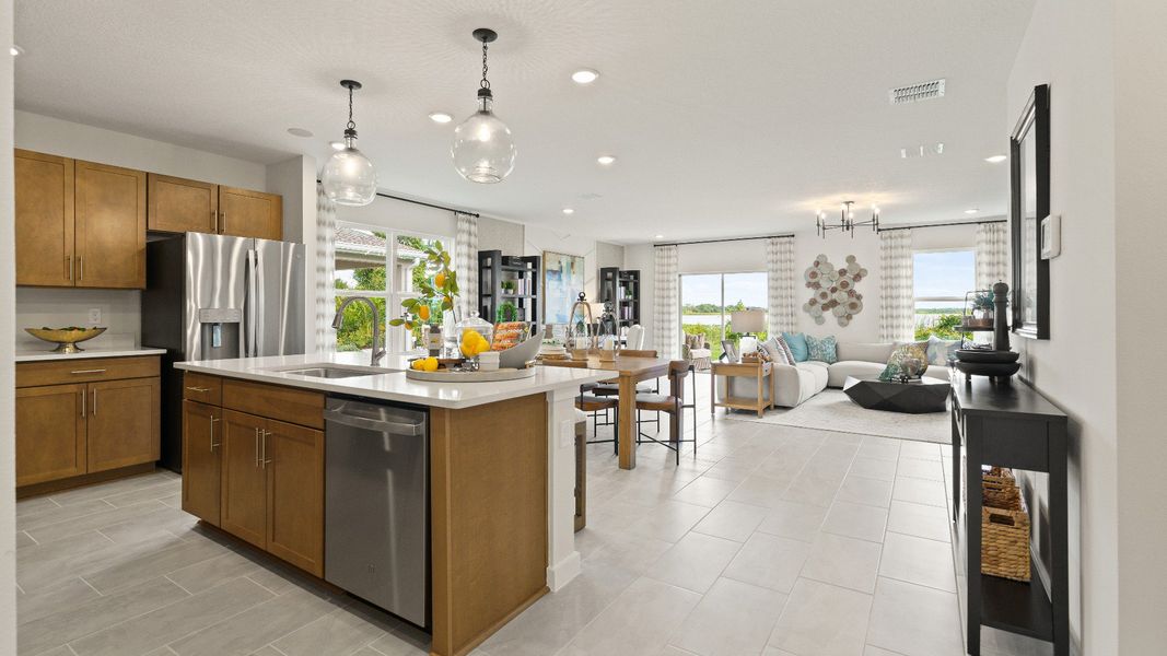 Castaway Model open concept living area and kitchen, new home plan available at Liberty Trace in Haines City, fl