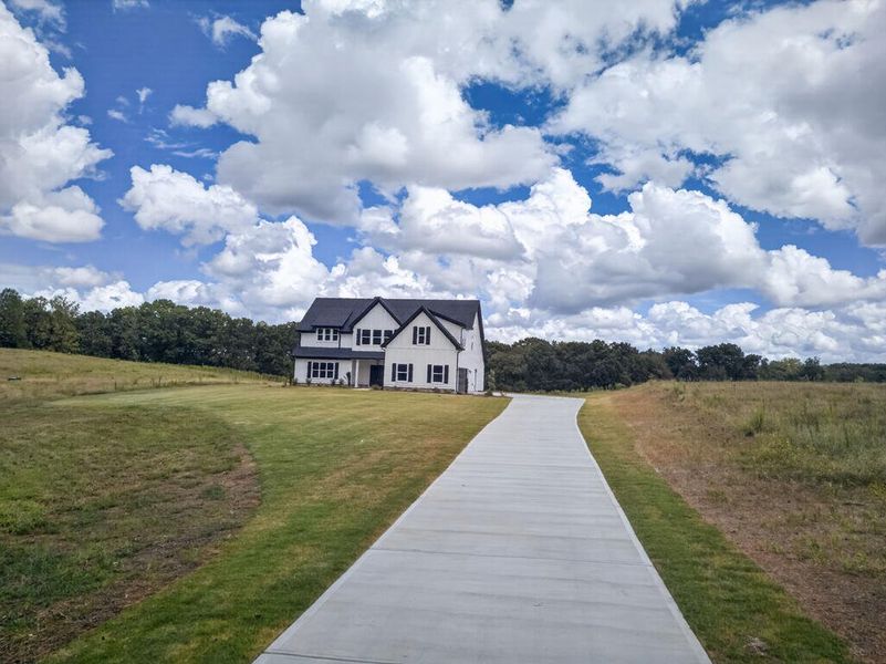 Front exterior of a new home in Blackwelder Bluff, Bowdon, GA, highlighting curb appeal (Image 27).