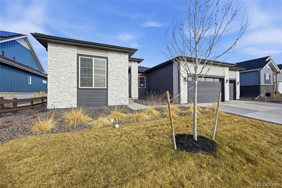 Exterior details and patio area of a home in Hilltop at Inspiration, Aurora (Image 25).