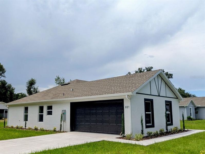 Front exterior of a new home in , Fort Meade, FL, highlighting curb appeal (Image 13).