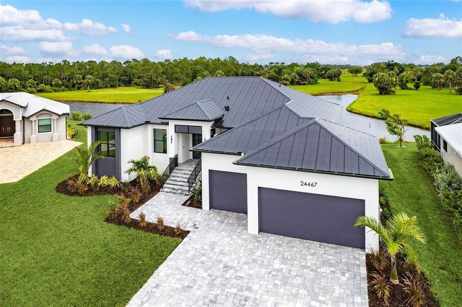 Front exterior of a new home in , Punta Gorda, FL, highlighting curb appeal (Image 12).