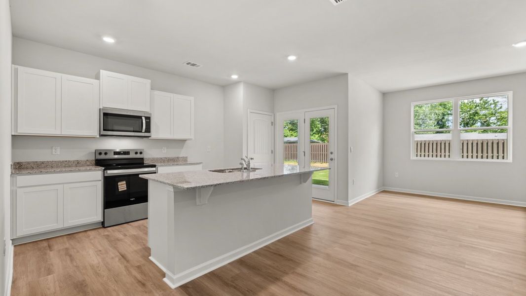 Representative furnished interior of a home built from the KERRY by D.R. Horton in Northberry, Rome (Image 6).