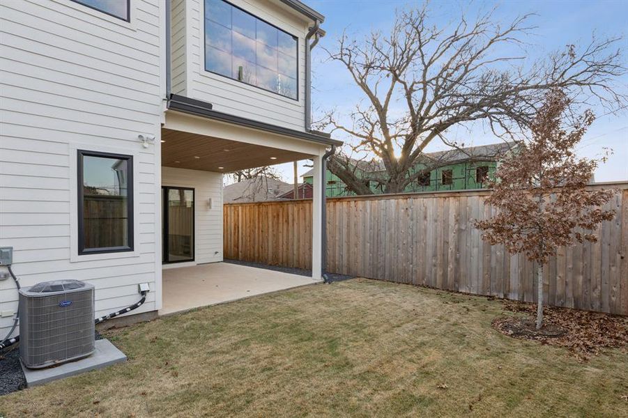 View of yard featuring cooling unit and a patio area