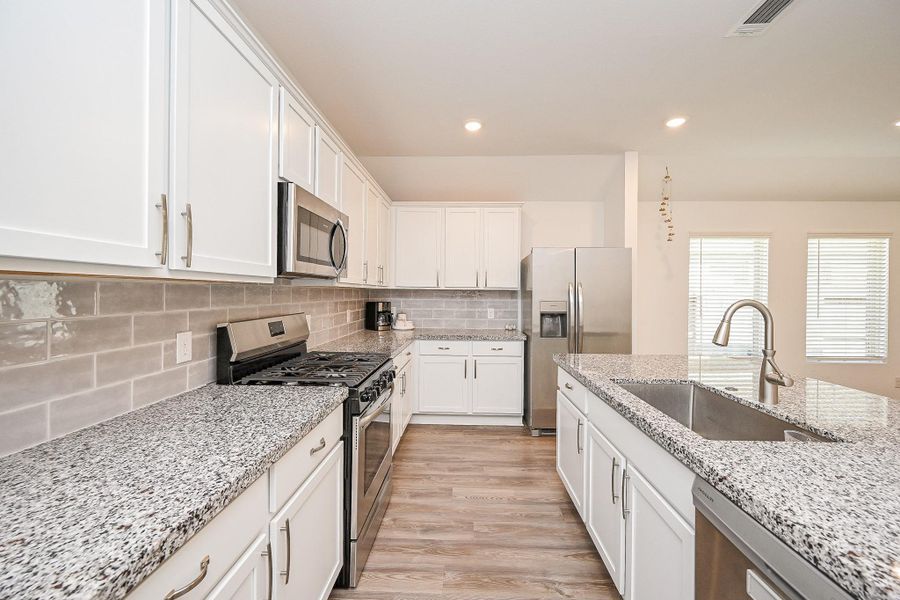 White cabinetry: Clean-lined and timeless, providing ample storage and a bright, fresh aesthetic. White cabinetry: Clean-lined and timeless, providing ample storage and a bright, fresh aesthetic.