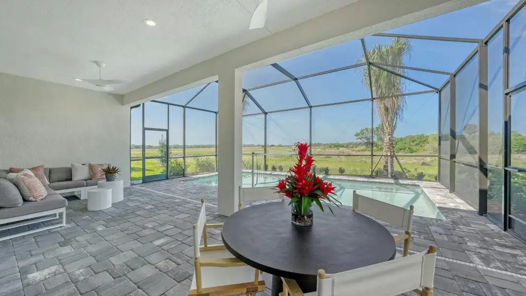 Exterior details and patio area of a home in Kingston South Real Estate and Homes for Sale in Estero, FL - Neal Communities, Estero (Image 3).