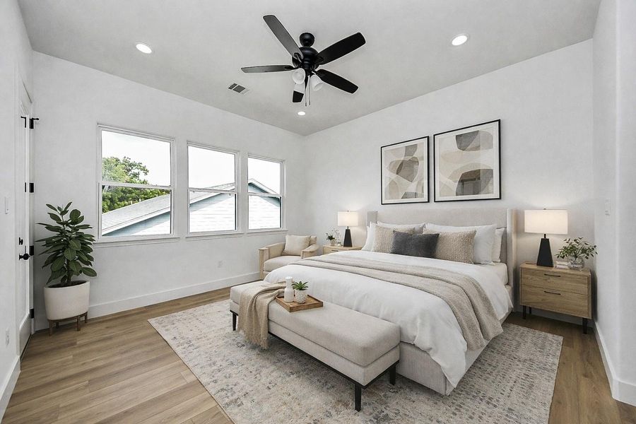 Spacious primary bedroom filled with natural light, featuring a clean, modern design and neutral tones. Generous layout offers comfort and flexibility, perfect for creating a relaxing retreat.