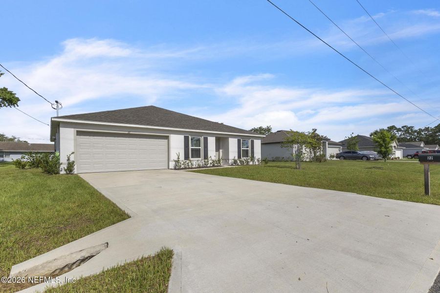 Front exterior of a new home in Palm Coast, Palm Coast, FL, highlighting curb appeal (Image 21).