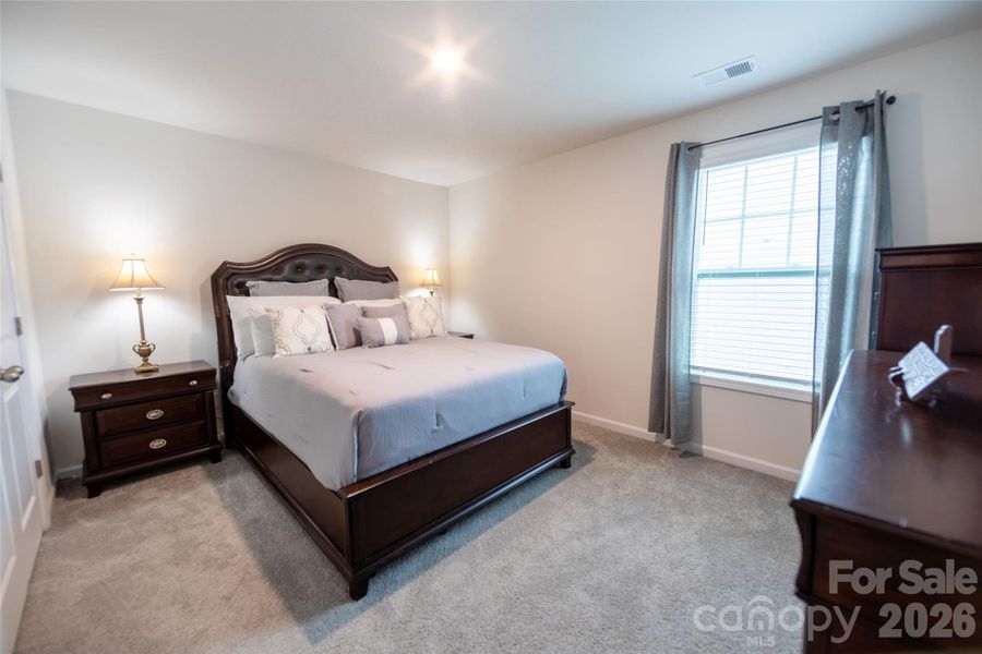Upper-level bedroom with ample closet space.