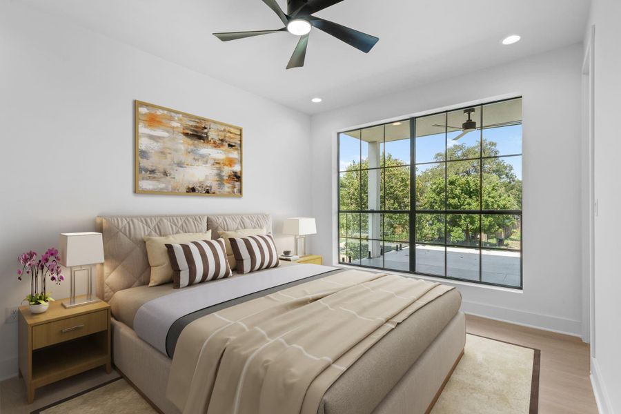 Virtually Staged: Secondary bedroom located upstairs with a dark stained ceiling fan, engineered wood floors, and large windows. Virtually Staged: Secondary bedroom located upstairs with a dark stained ceiling fan, engineered wood floors, and large windows.