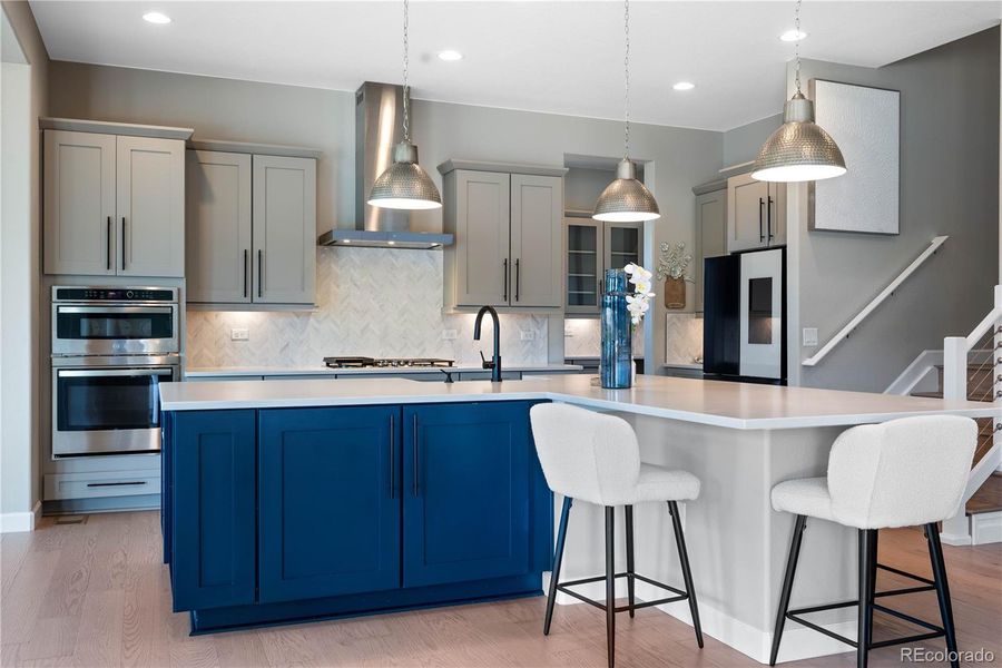 Gourmet Kitchen with two tone cabinets, Custom Hood and Double Oven