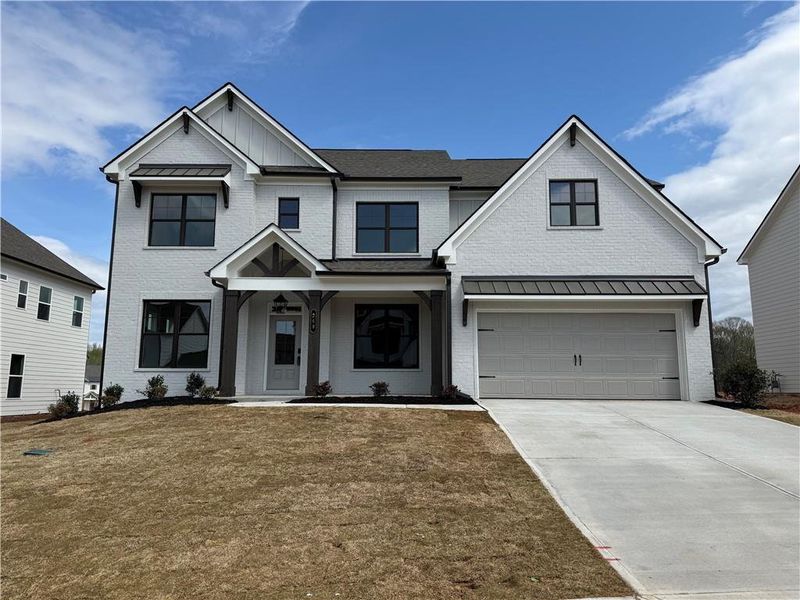 Front exterior of a new home in Rosewood Lake Estates, Hoschton, GA, highlighting curb appeal (Image 2). Front exterior of a new home in Rosewood Lake Estates, Hoschton, GA, highlighting curb appeal (Image 2).