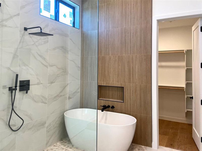 Freestanding soaking tub within a glass-enclosed shower. Finishes that feel like a luxury hotel. (construction photos - professional photos upon completion) Freestanding soaking tub within a glass-enclosed shower. Finishes that feel like a luxury hotel. (construction photos - professional photos upon completion)