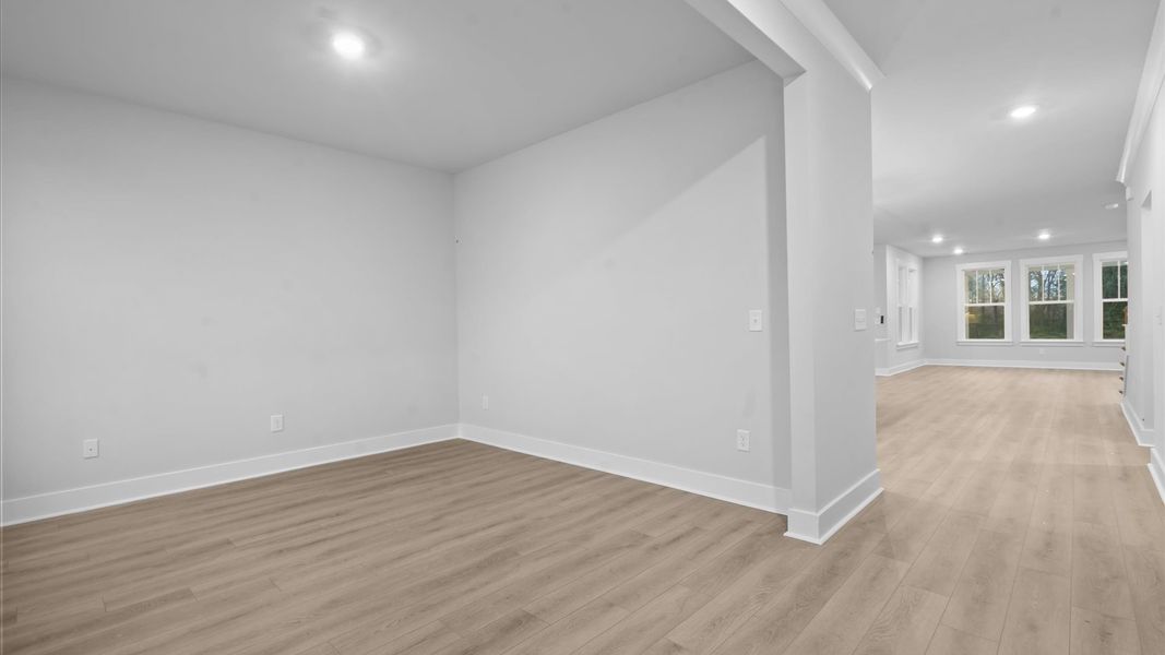 Functional flex room with tasteful hardwood floors and exceptional natural light Functional flex room with tasteful hardwood floors and exceptional natural light