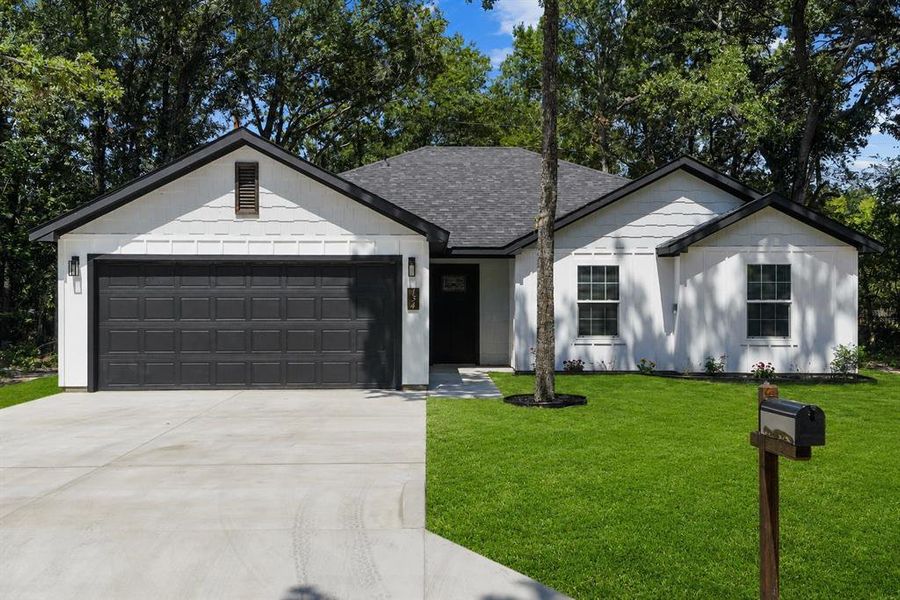 Contemporary single-story residence with a dark asphalt shingle roof Contemporary single-story residence with a dark asphalt shingle roof