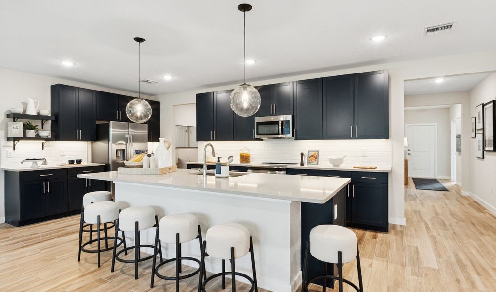 Kitchen with pendant lighting and floating shelves