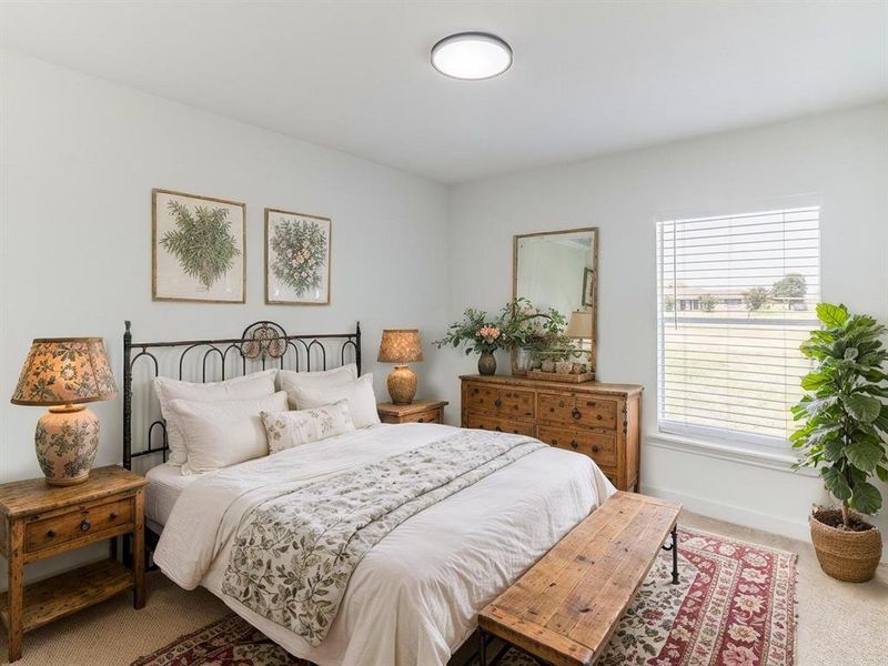 Virtually Staged Bedroom featuring carpet flooring and baseboards Virtually Staged Bedroom featuring carpet flooring and baseboards