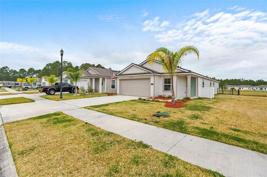 Front exterior of a new home in , Bunnell, FL, highlighting curb appeal (Image 22).