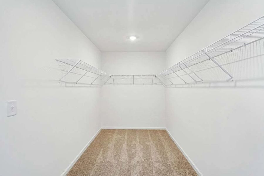 Sample Photo: Primary Bedroom Walk-In Closet Sample Photo: Primary Bedroom Walk-In Closet