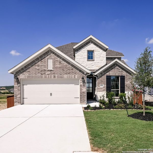 Front exterior of a new home in Homestead 55', Cibolo, TX, highlighting curb appeal (Image 1). Front exterior of a new home in Homestead 55', Cibolo, TX, highlighting curb appeal (Image 1).