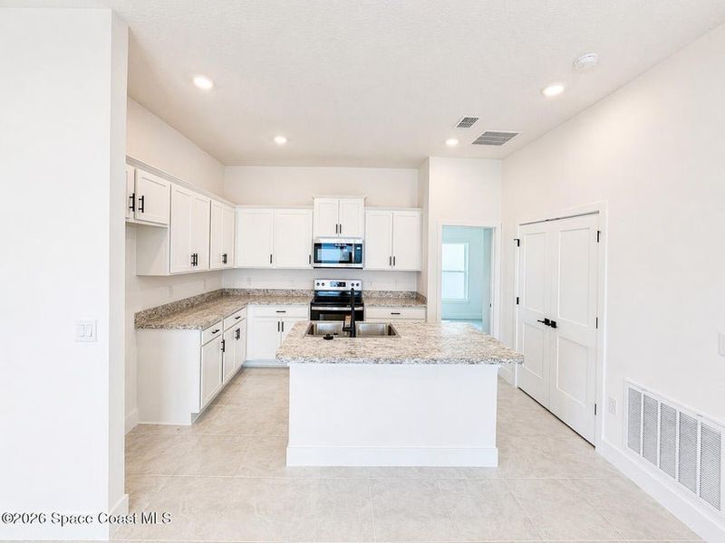 Furnished interior view inside a new home in St. John's Preserve, Palm Bay (Image 5).